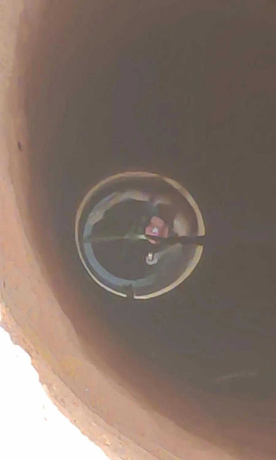Clean water visible at the bottom of a newly dug well